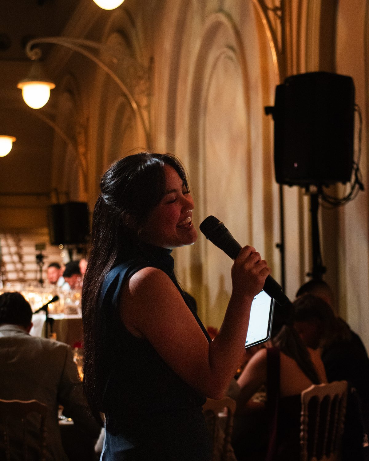 Wedding singer Karmina Mae performing live at a candlelit wedding reception